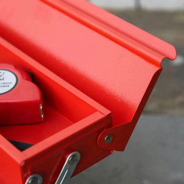 Red metal toolbox side corner with latch pin and silver hinge bar