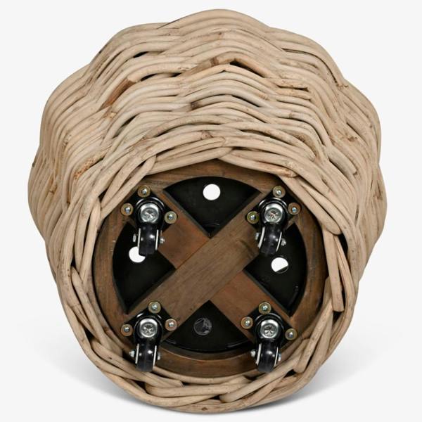 Underside of the rattan planter showing the castor wheels and wooden support base.