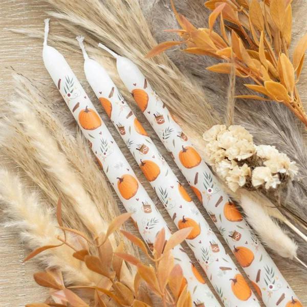Set of 3 white taper candles with orange pumpkin pattern, fall-themed print