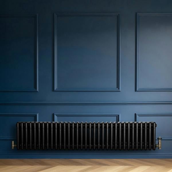 Traditional black 4 column radiator, 300 x 1505mm, mounted on a blue wall, featuring a sleek, glossy finish and elegant design