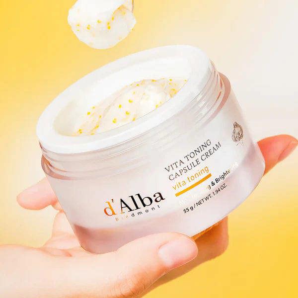 Bursting yellow capsules in d'Alba Vita Toning Cream – Refreshing gel-to-cream texture for an instant luminosity boost at Atelier De Glow UK.