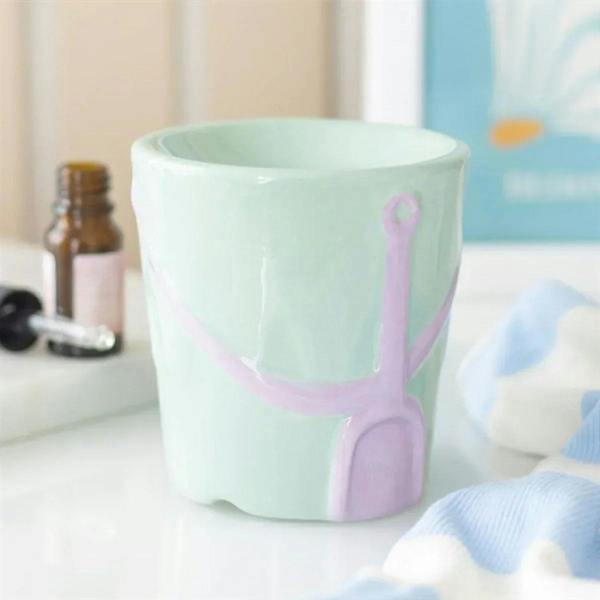 Pastel ceramic bucket oil burner with purple spade handle detail