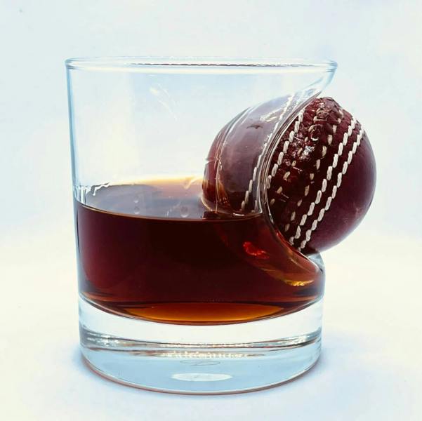 Personalised Cricket Ball Whisky Glass - product in use
