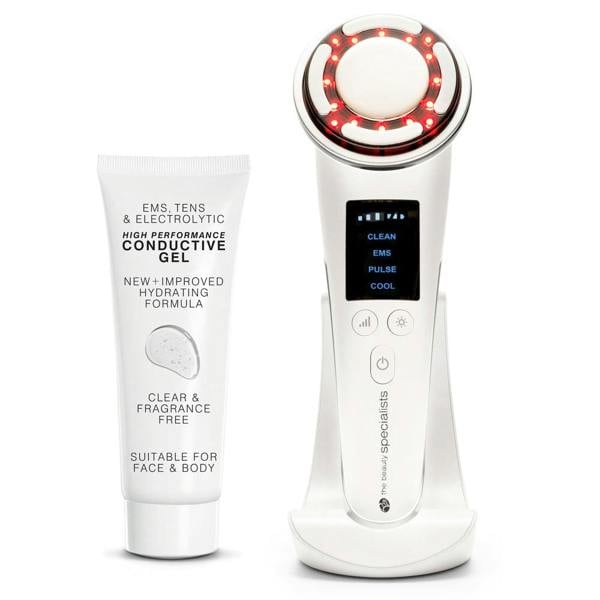 A white tube of conductive gel is placed beside the Rio Face Lift & Tone Beauty Spa device, featuring a digital screen, control buttons, red LED lights, and a charging stand—both designed for skincare treatments and firmer-looking skin.