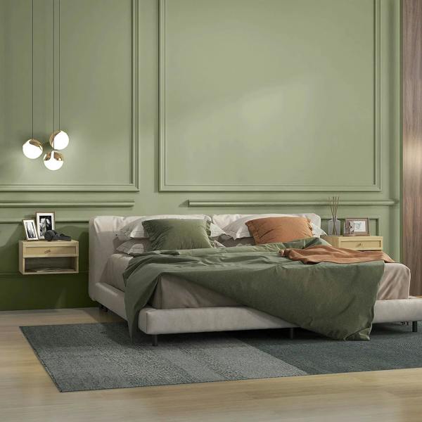 Natural wood-effect floating bedside table with rattan-front drawer beside bed