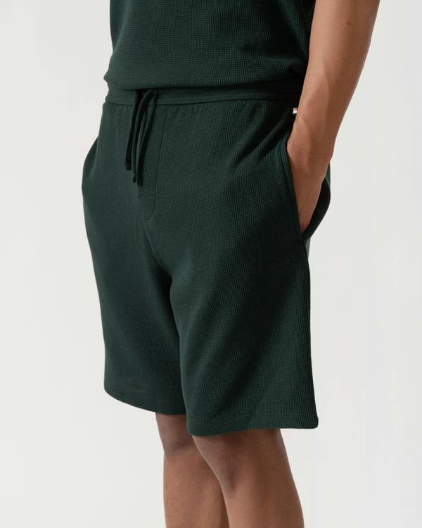 Detail shot of BOSS Orange Waffle Mens Cotton Blend Waffle Structure Pyjama Shorts with Embroidered Logo - Dark Green 308