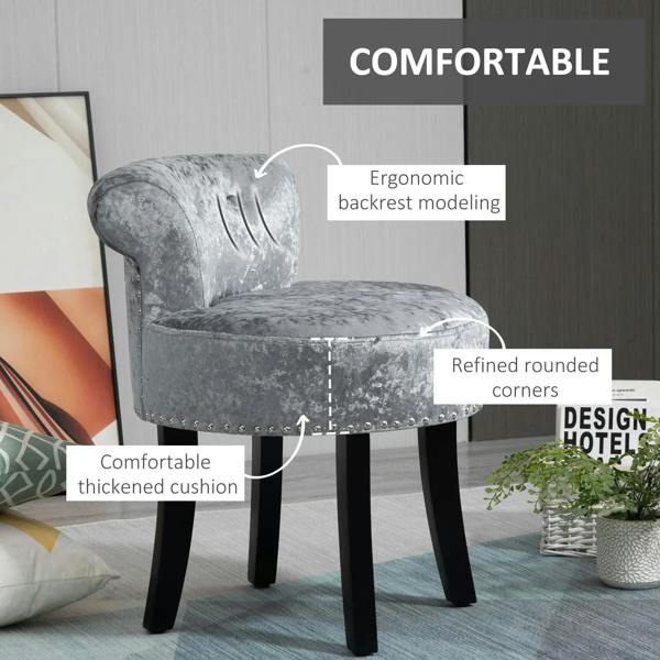Grey velvet vanity stool with curved backrest, rounded corners, studded base, black legs