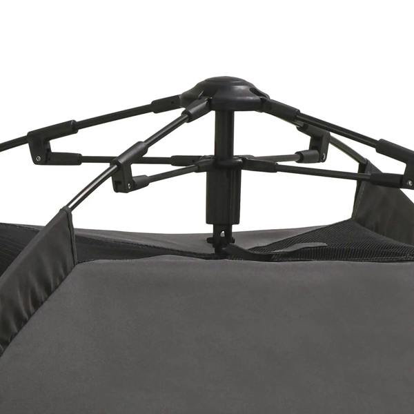Close-up of black pop-up tent frame and dark fabric base