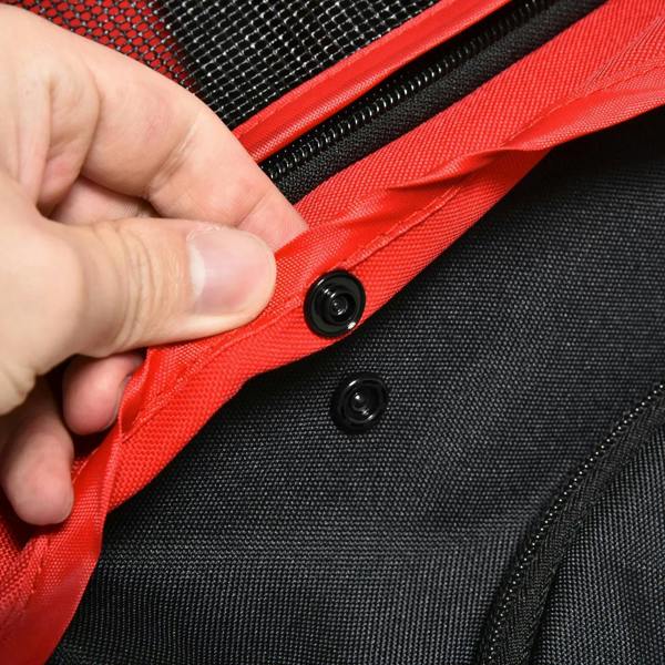 Red and black pet stroller fabric strap fastening detail with mesh panel