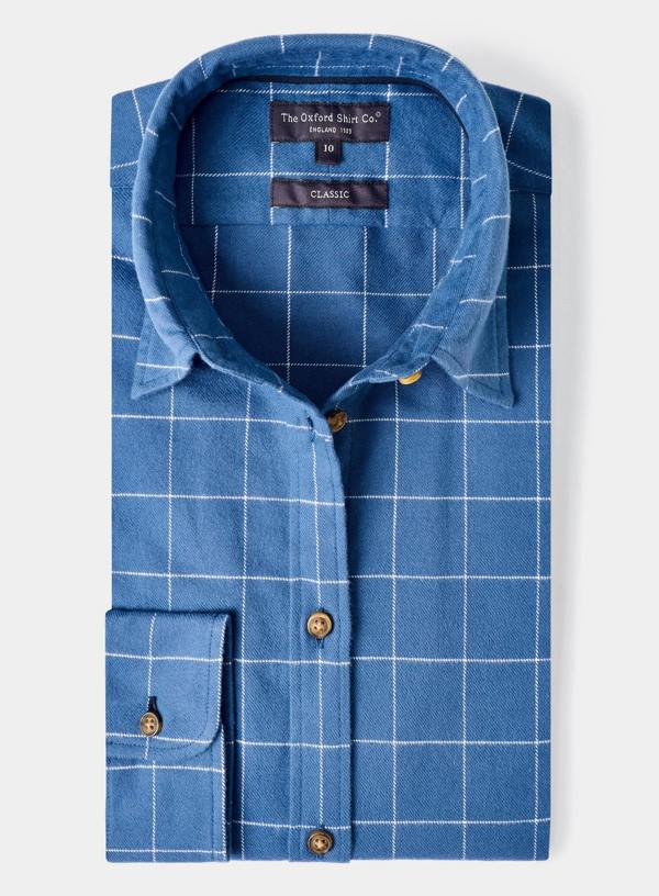 Blue checkered shirt with brand labels on a white background