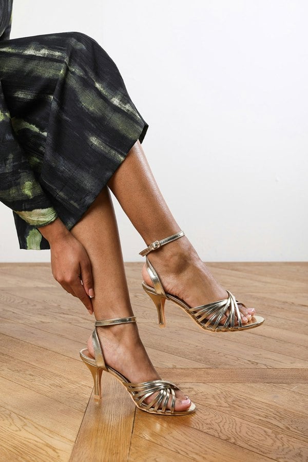 Where's That From Maisie Heeled Sandal With Flared Stiletto in Gold Faux Leather