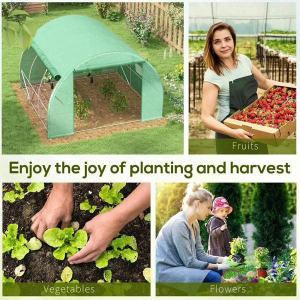 Green walk-in greenhouse tent with zipped front opening in a garden yard
