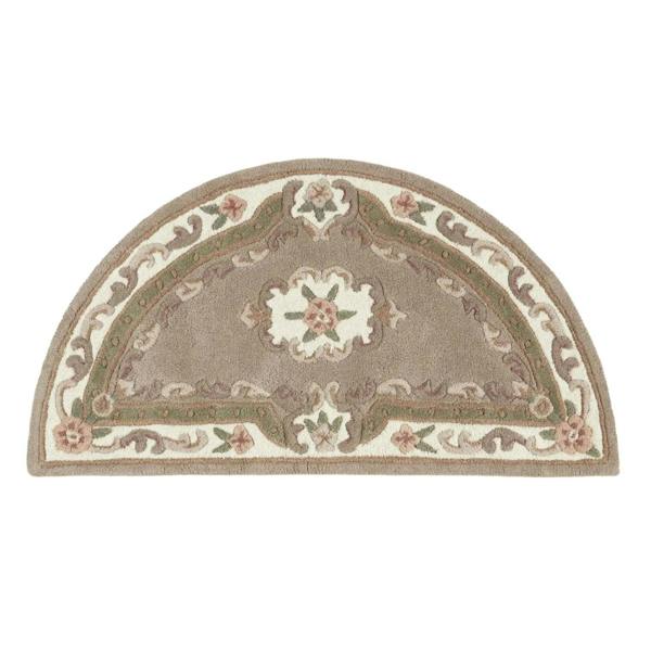 Decorative half-moon rug with floral patterns on a white background