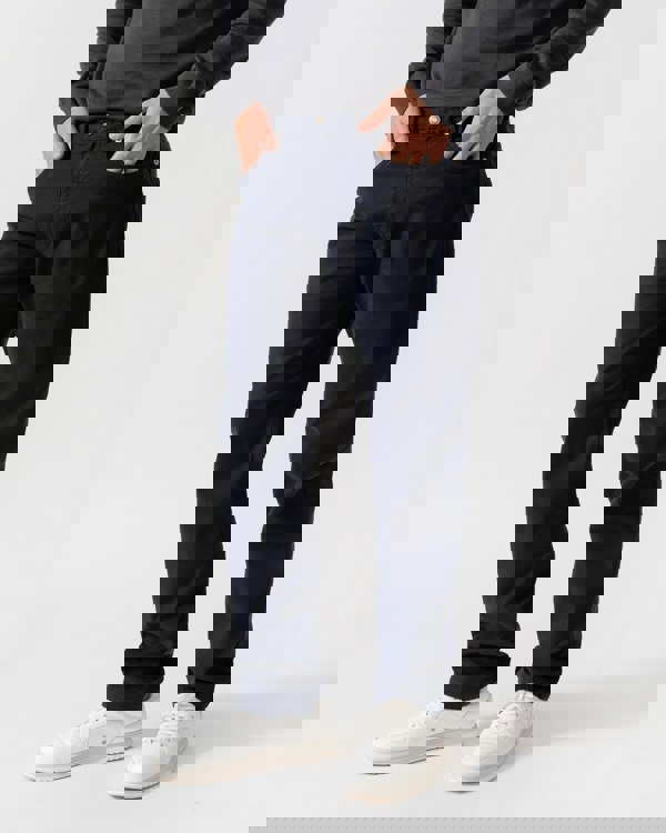 Model is wearing GANT Mens Regular Fit Desert Jeans in 433 Evening Blue - Pockets