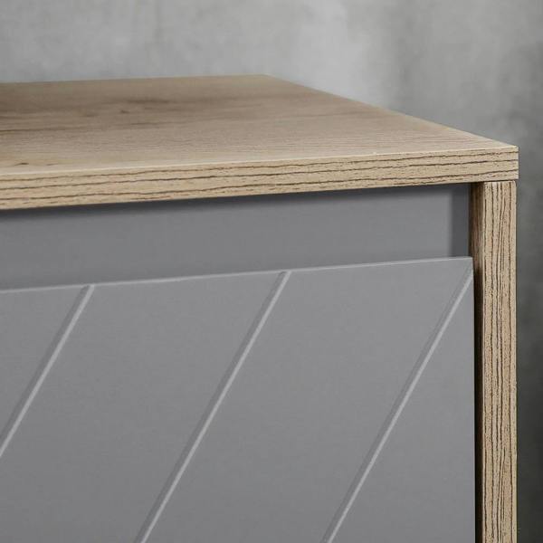 Grey door panel with diagonal decorative lines on oak cabinet frame, flat tabletop