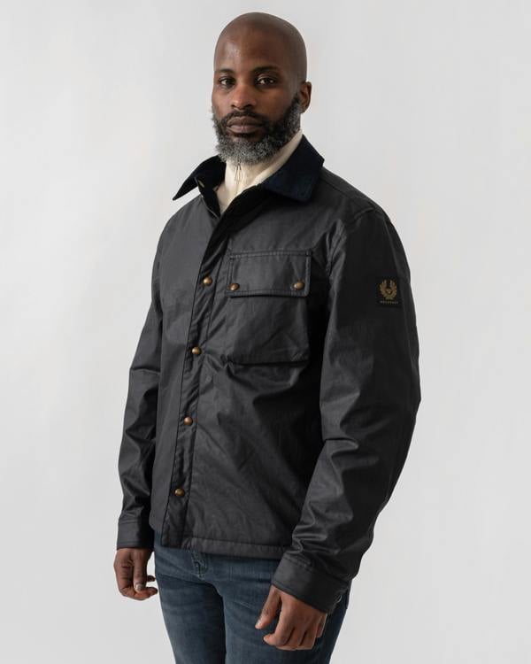 Model wearing Belstaff Ground Mens Jacket in Dark Navy - side zipped up