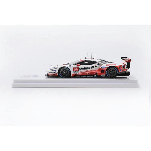 a white race car on a white stand