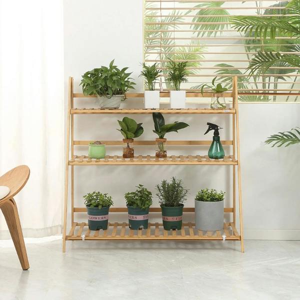 3-tier bamboo plant shelf rack displaying multiple potted plants on slatted boards