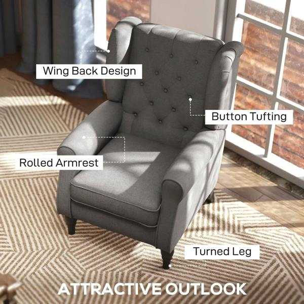 Dark grey wingback armchair close-up with button tufting, rolled armrests, and turned legs
