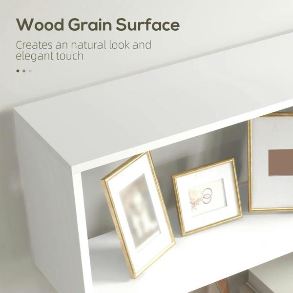 White bookshelf shelf corner with wood-grain surface and framed decor on tier