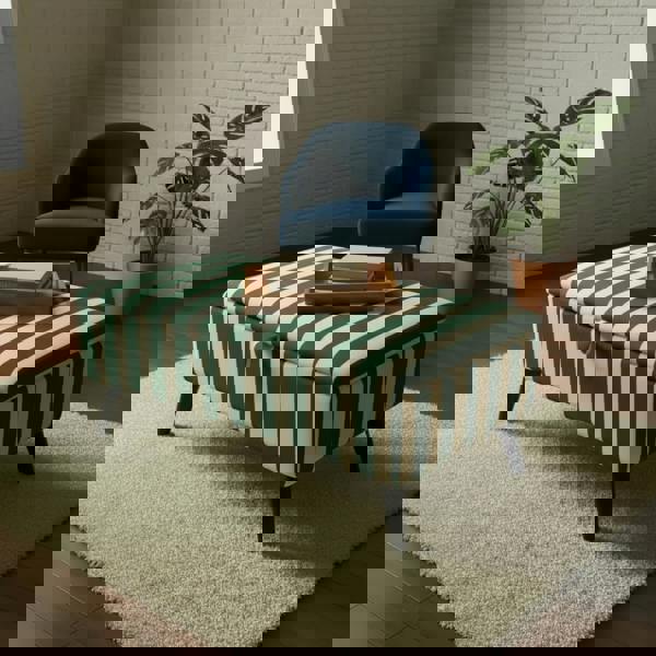 Durable hinged lid ottoman with strong black legs and premium fabric