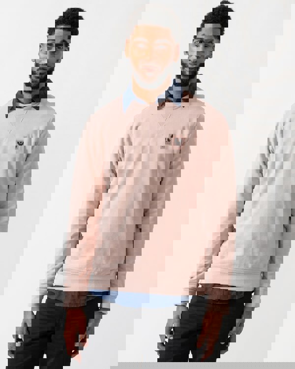 model wearing a Belstaff Mens Crew Neck Sweatshirt With Logo Patch in Dusk Pink