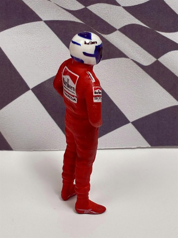 a toy figure of a man wearing a helmet