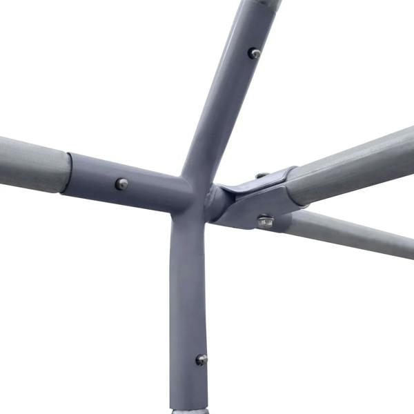 Gray metal coop frame corner joint with bolts and tubing crossbar