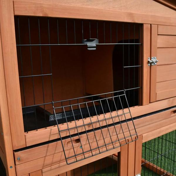 Close-up of 2-tier rabbit hutch front: metal wire grid, wooden door, and latch hardware