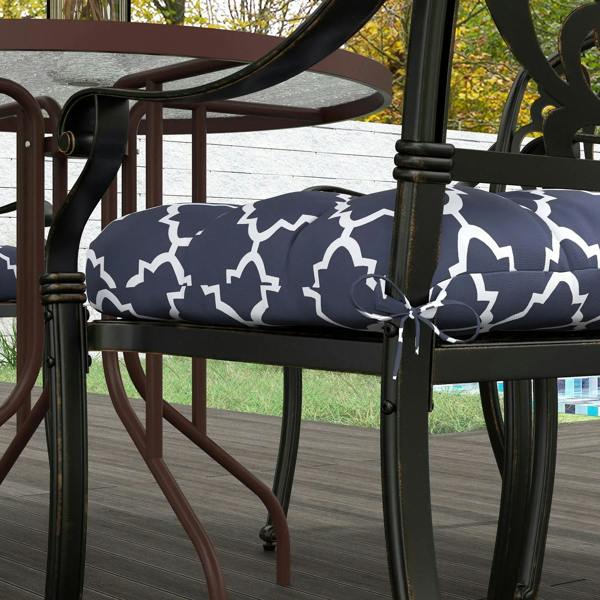 Navy blue patio chair seat cushion with white trellis pattern and tie strap
