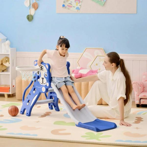 Blue bear-themed baby slide climber with basketball hoop, toddler playing indoors