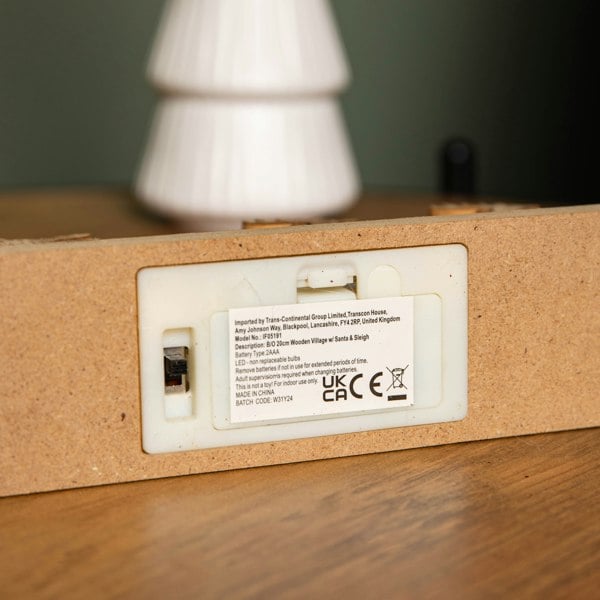 Samuel Alexander 20cm Battery Operated Light up Wooden Village with Santa in Sleigh and Warm White LEDs