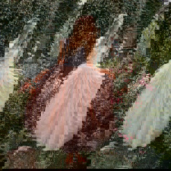 young flower girl in garden