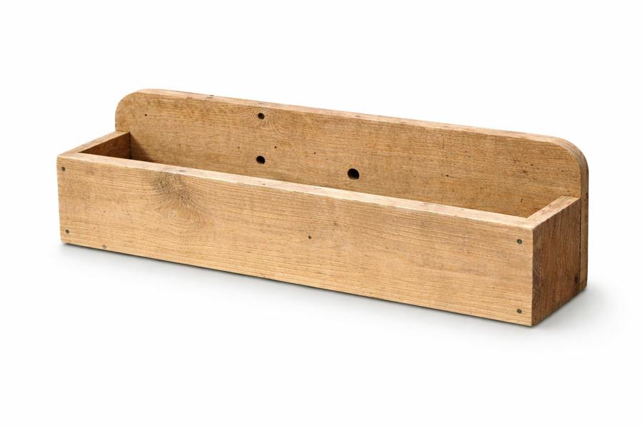 Wall mounted rough sawn wooden garden trough isolated on white background