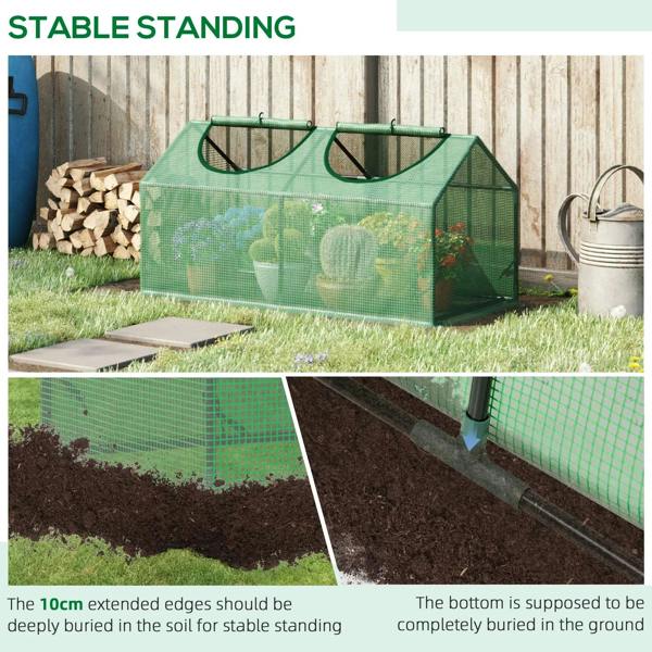 Green mini greenhouse on outdoor grass with mesh sides and low raised bottom frame