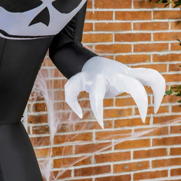White claw hands on a black inflatable ghost body