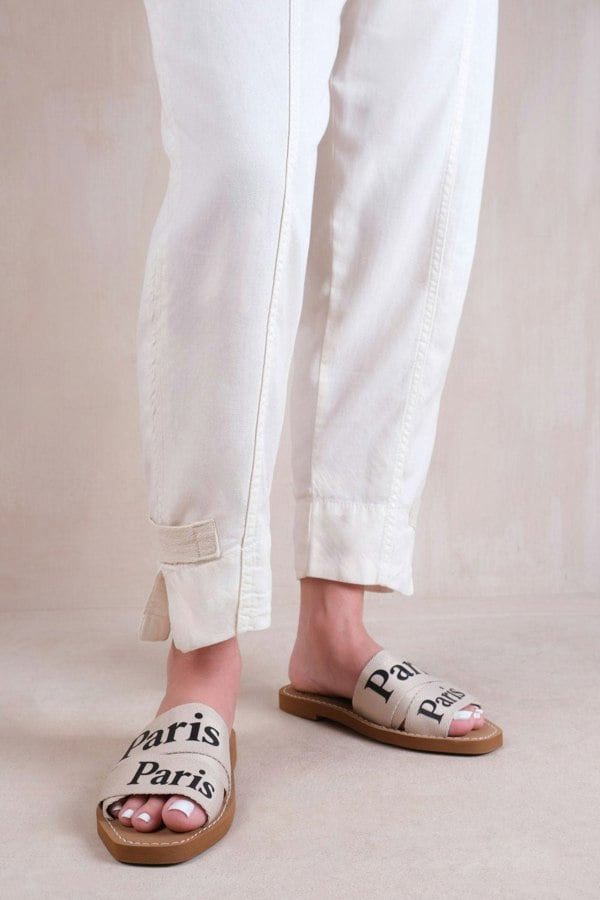 Where's That From Bella Flat Sandals With Cross Over Band in Nude Faux Leather