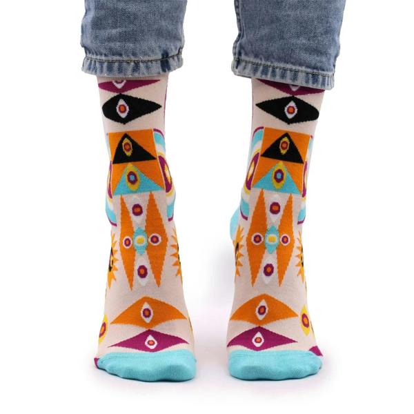 Crew socks with multicolor psychedelic eye and geometric pattern, teal heel and toe trim.