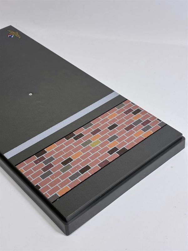 a rectangular object with a brick wall