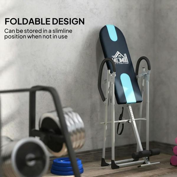 Foldable inversion table stored in compact position with black-and-blue backrest pad