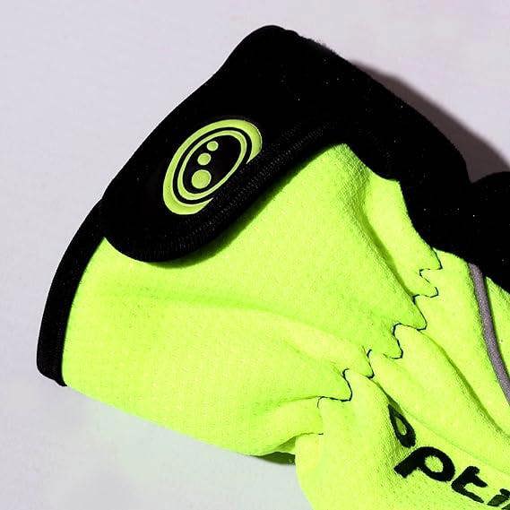 Close-up of fluorescent yellow winter glove cuff with black hook-and-loop wrist strap and logo badge - Optimum