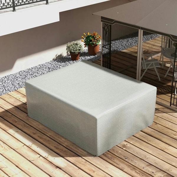 Grey outdoor patio furniture cover fitted on a bench cushion in a garden patio area.