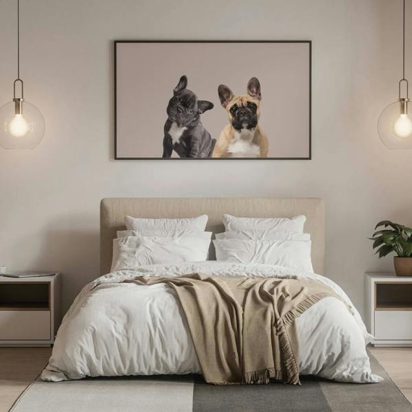 Large custom landscape illustration of two French Bulldogs in a thin black frame hanging over a neutral-toned double bed.
