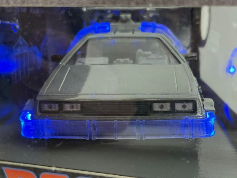 a toy car in a plastic case