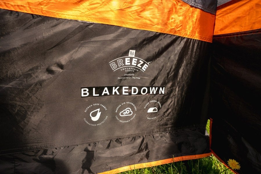 A closeup of the OLPRO Blakedown Breeze 4 Berth Inflatable Tent name and technology logos.