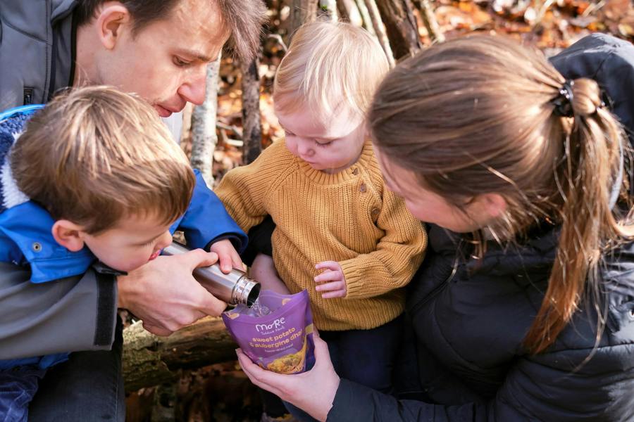 Family outdoors, preparing a more toddler meals together for a quick and healthy meal.