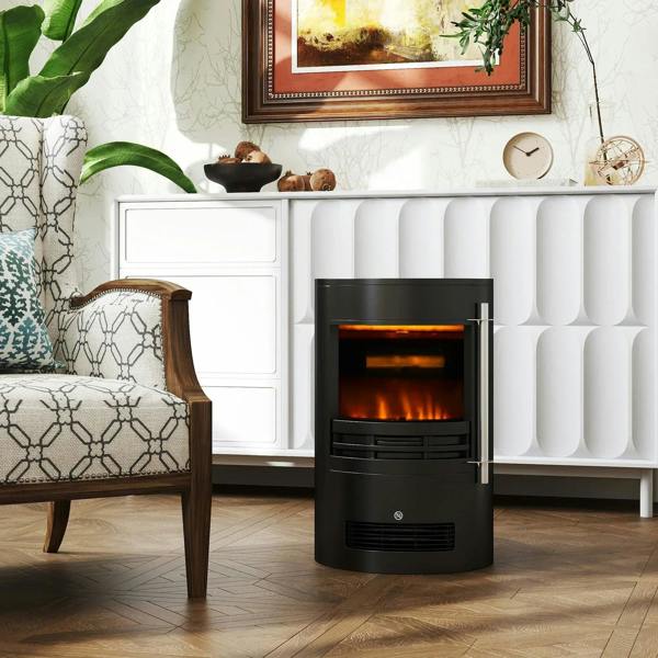 Black electric fireplace heater with flame effect window placed against a white wall radiator