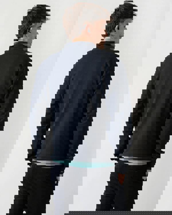 back shot of a model wearing a Moose Knuckles Hartsfield Mens quarter Zip Sweatshirt in Navy 833