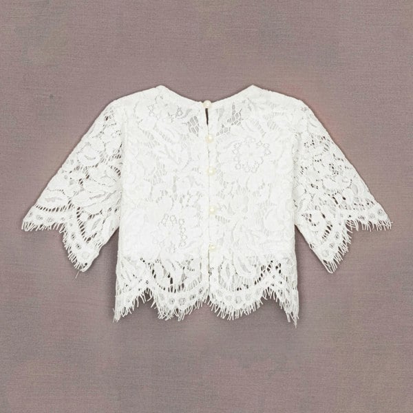 White lace top on a brown background