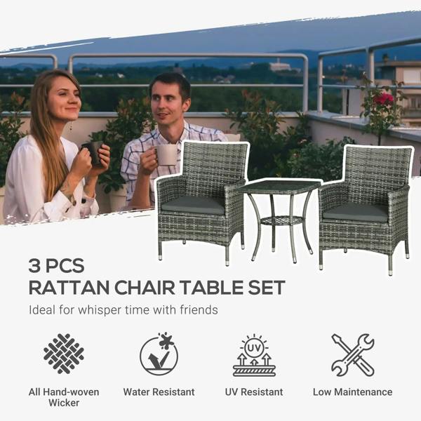Rattan bistro set with two grey woven chairs and two-tier glass coffee table outdoors